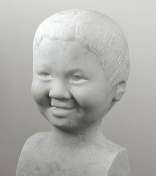 This is a portrait carved directly into carrara marble by UK portrait painter, commissioned in 2010